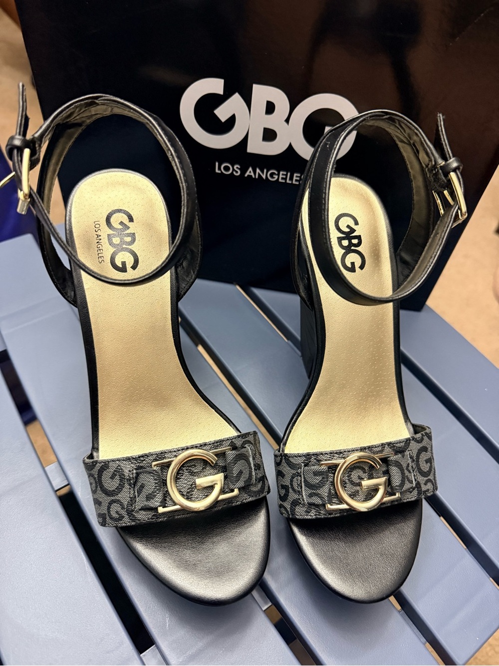 GBG Los Angeles Black and Gold Logo Ankle-Strap Heels